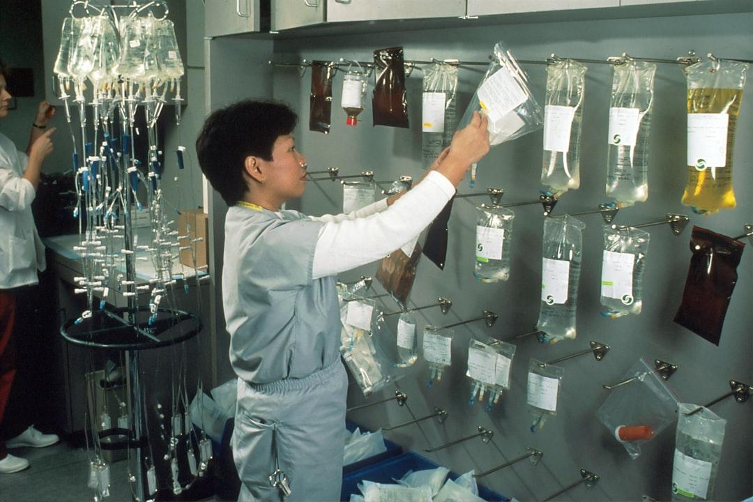 Woman arranging iv bags from National Cancer Institute on Unsplash