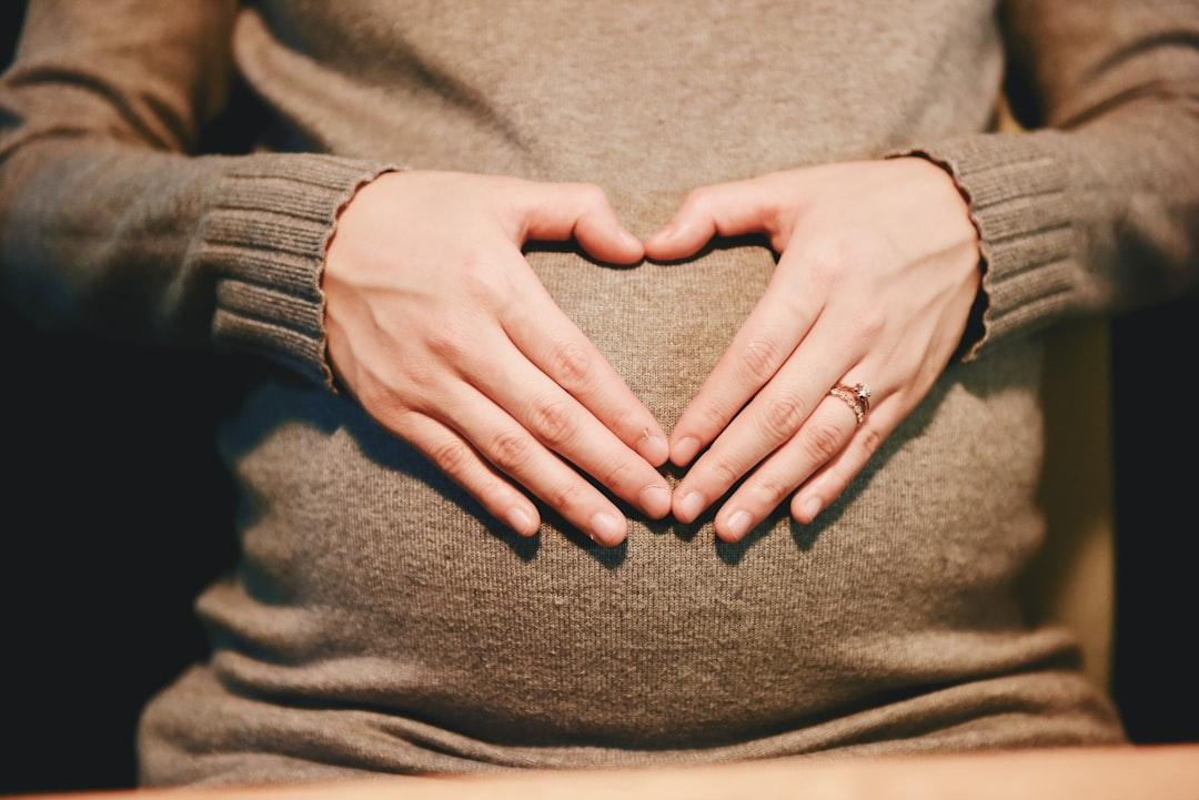 Person holding belly photo from Suhyeon Choi on Unsplash