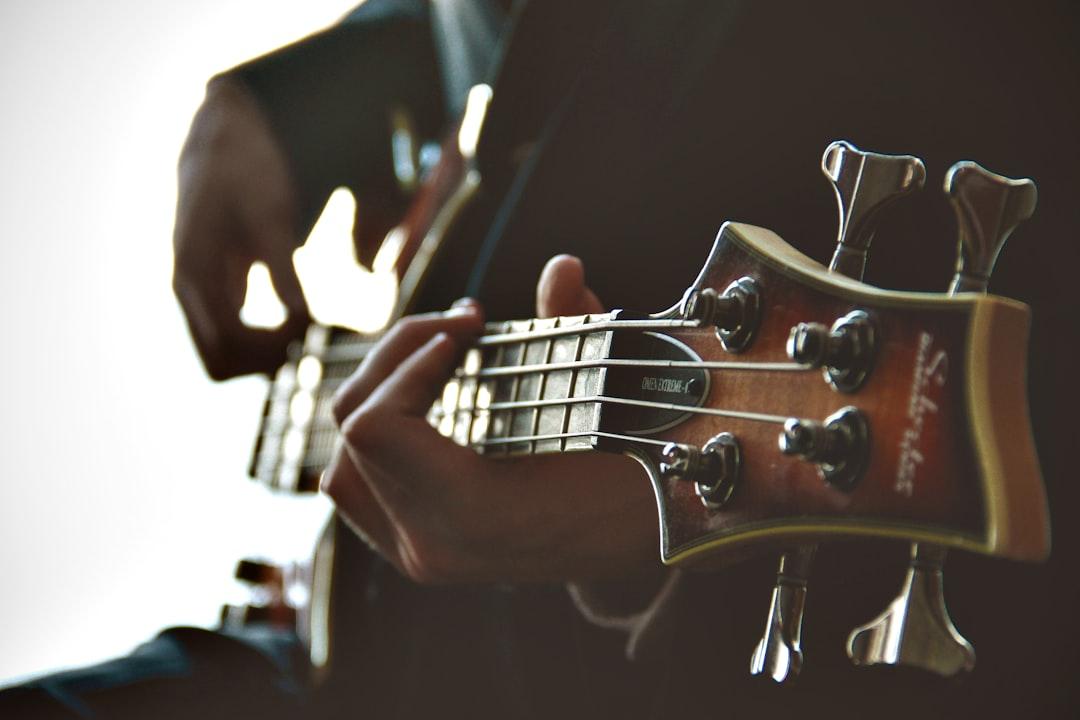Person playing guitar from Derek Truninger on Unsplash