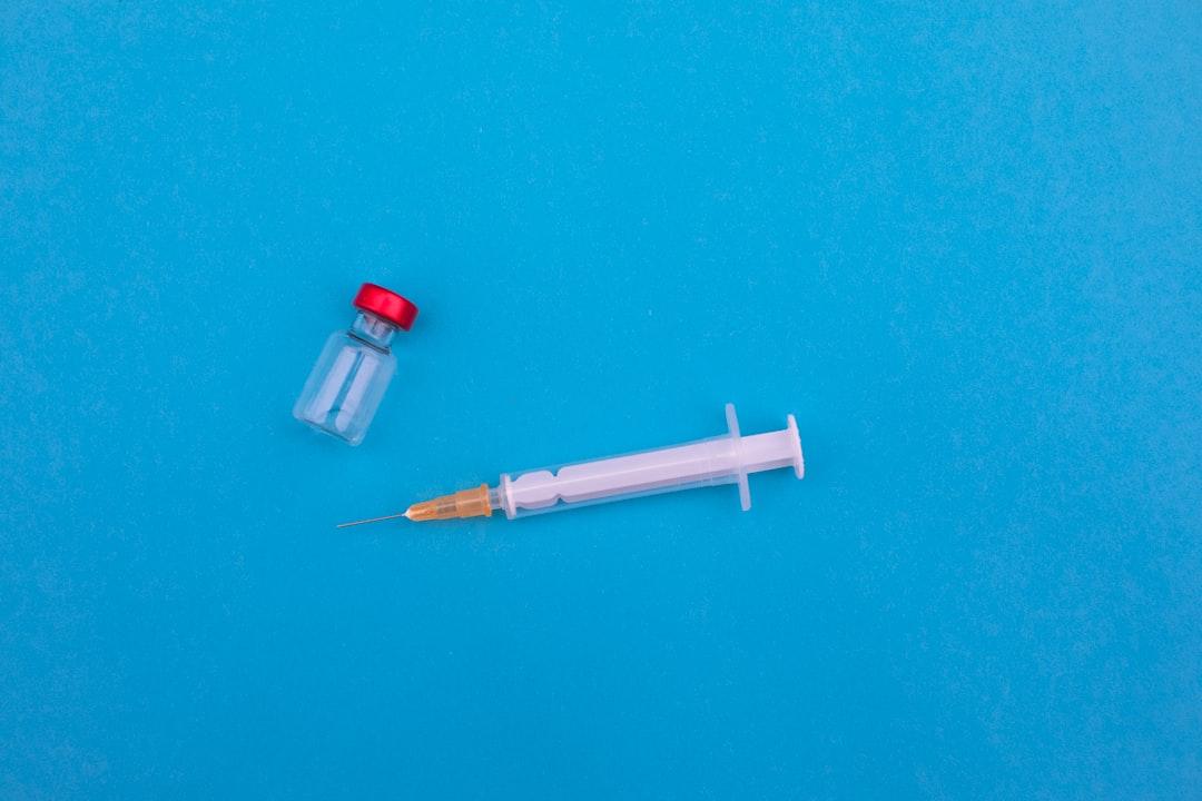 Red and white pen on green textile from Markus Spiske on Unsplash