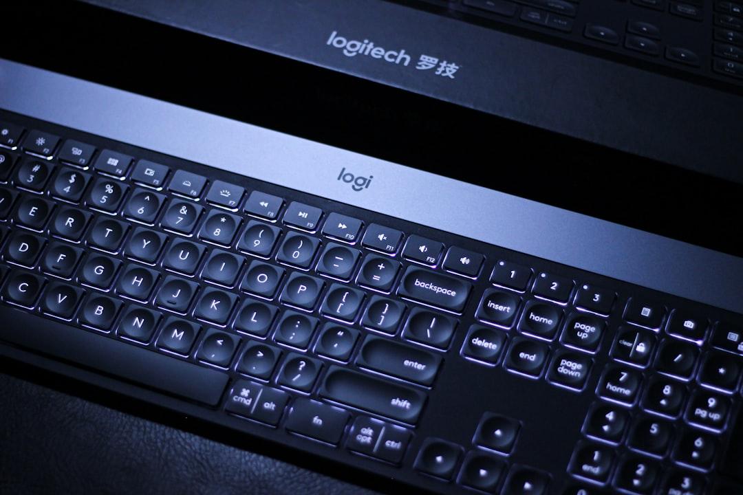 A black keyboard with a white background from Saif Ahmed on Unsplash