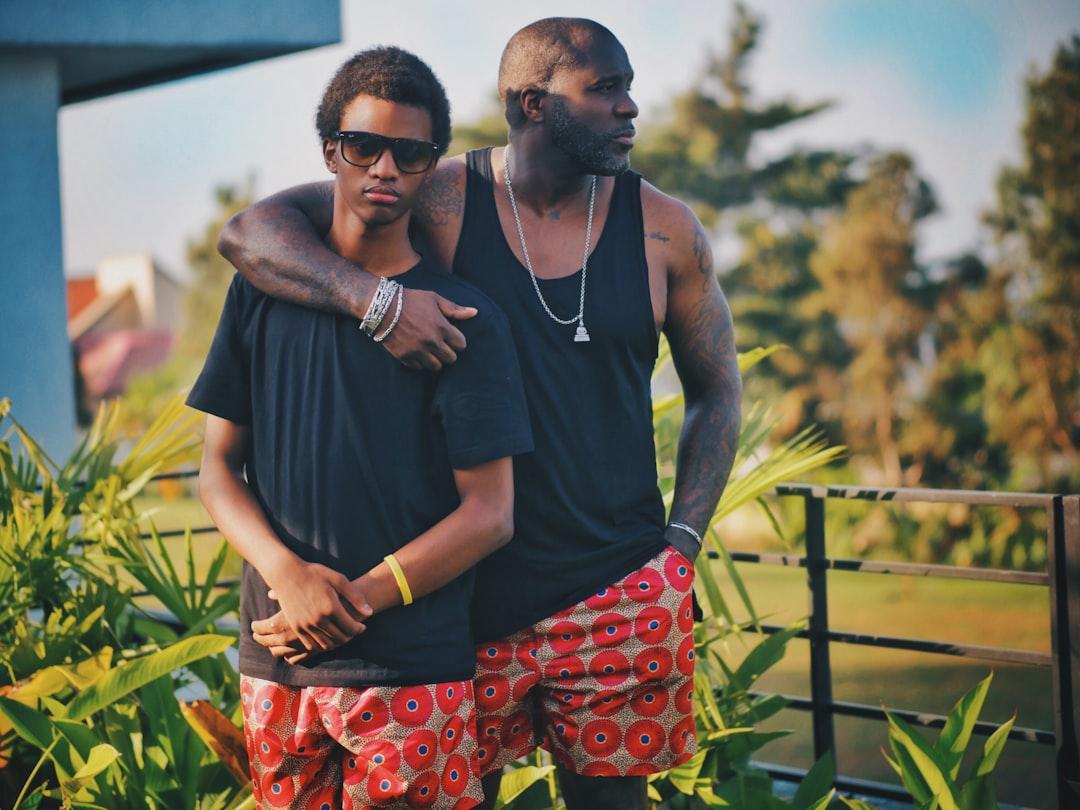 Two men same standing near green leaf plant from Kaysha on Unsplash