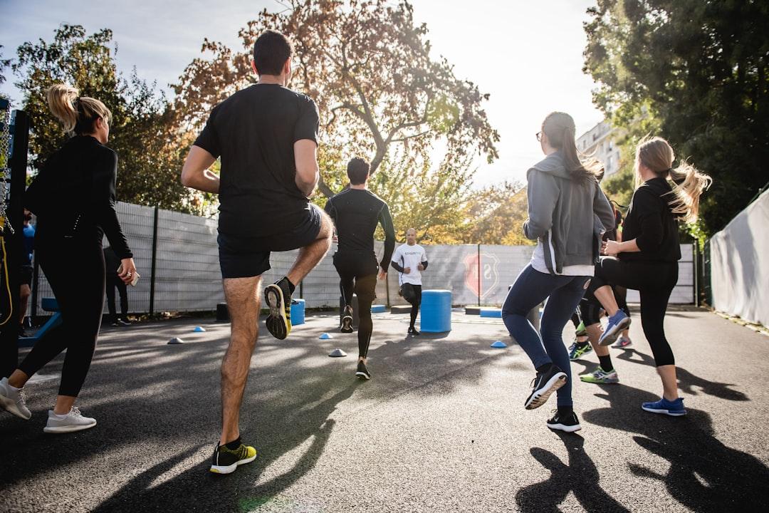 Man in black t-shirt and black shorts running on road during daytime from Gabin Vallet on Unsplash