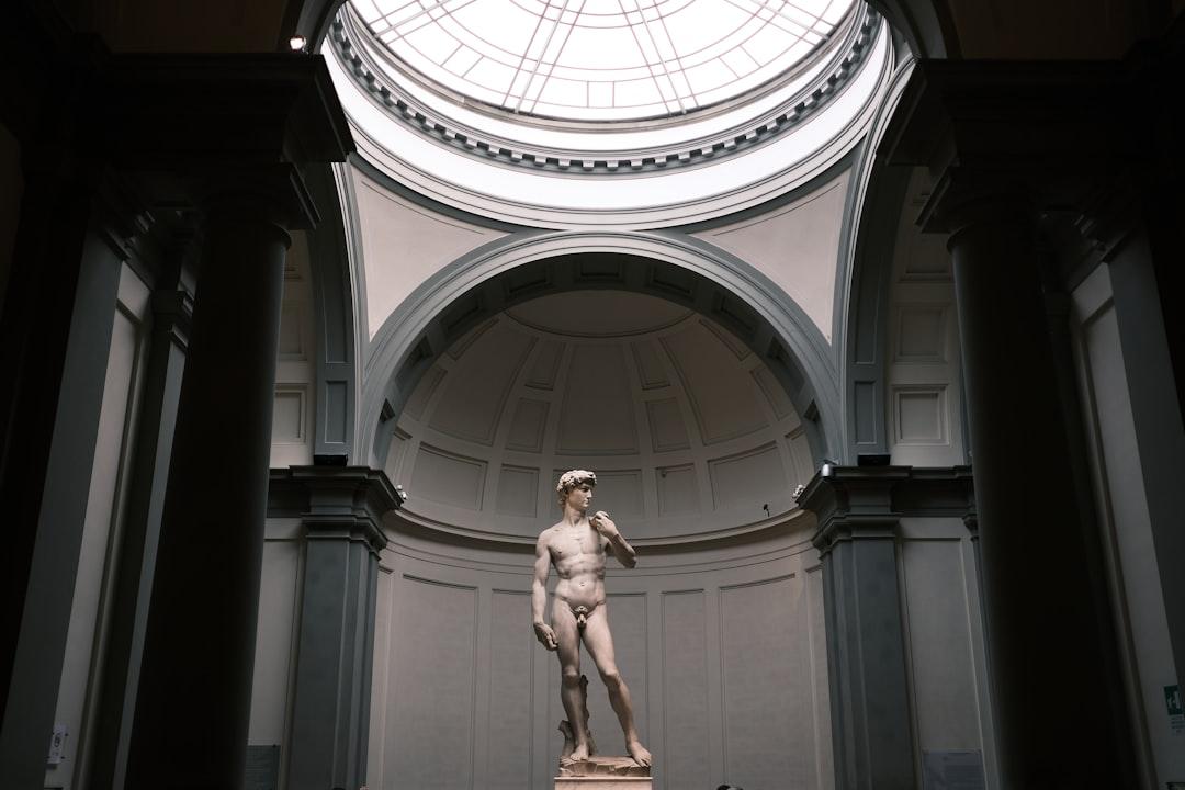 A statue of a man in a building from Chelms Varthoumlien on Unsplash
