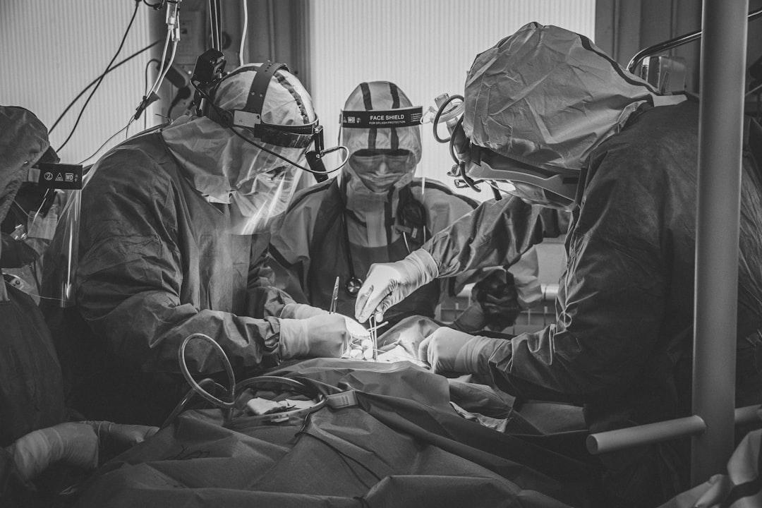 A group of doctors performing surgery in a hospital from Jannes Jacobs on Unsplash