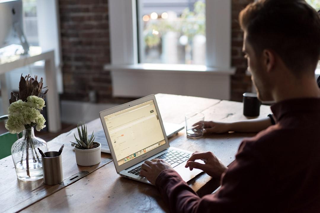 Man operating laptop on top of table from Bench Accounting on Unsplash