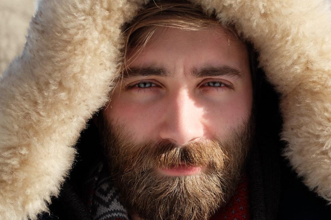 Man covered by beige fur textile from Frank Marino on Unsplash