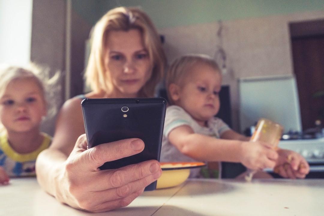 Woman in white shirt holding black ipad from Vitolda Klein on Unsplash