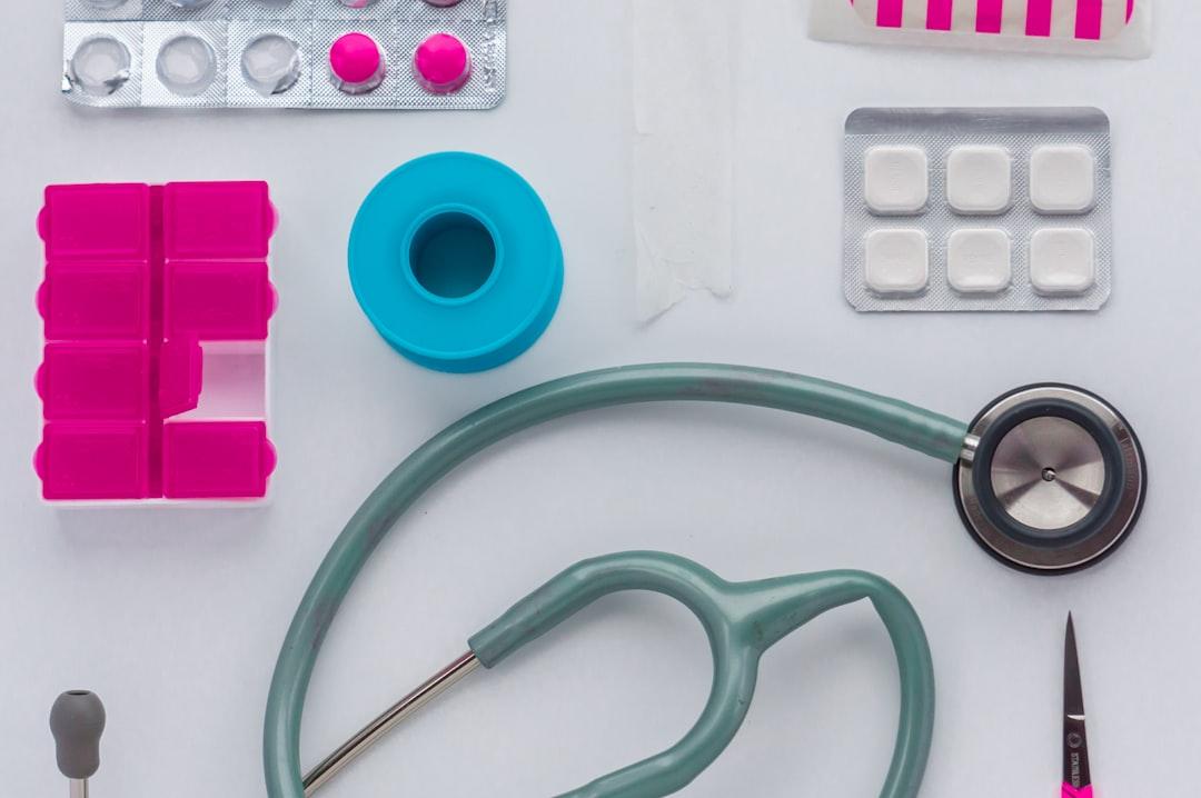 Green and black stethoscope on white printer paper from Derek Finch on Unsplash