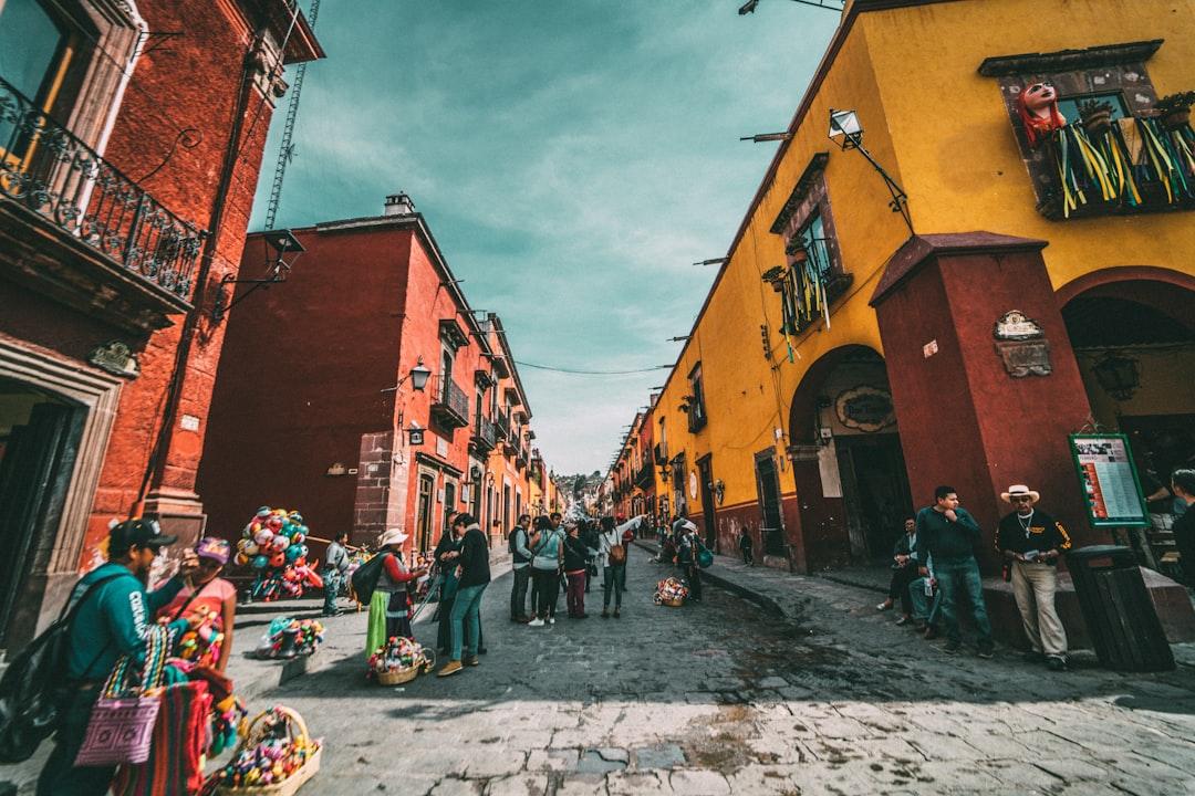 People standing on corner road near concrete buildings during daytime from Jezael Melgoza on Unsplash