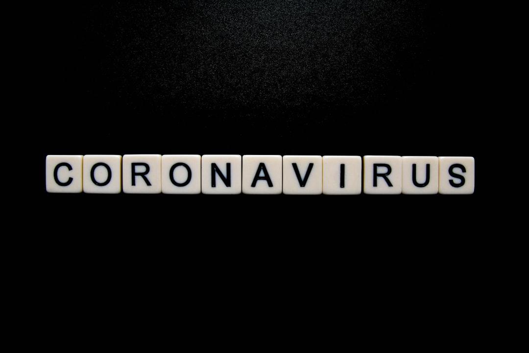 Coronavirus on black background from Glen Carrie on Unsplash
