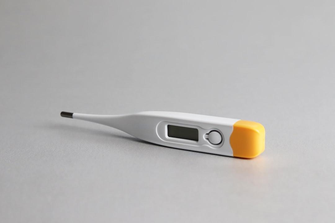 White and yellow thermometer on white surface from Edgar Soto on Unsplash