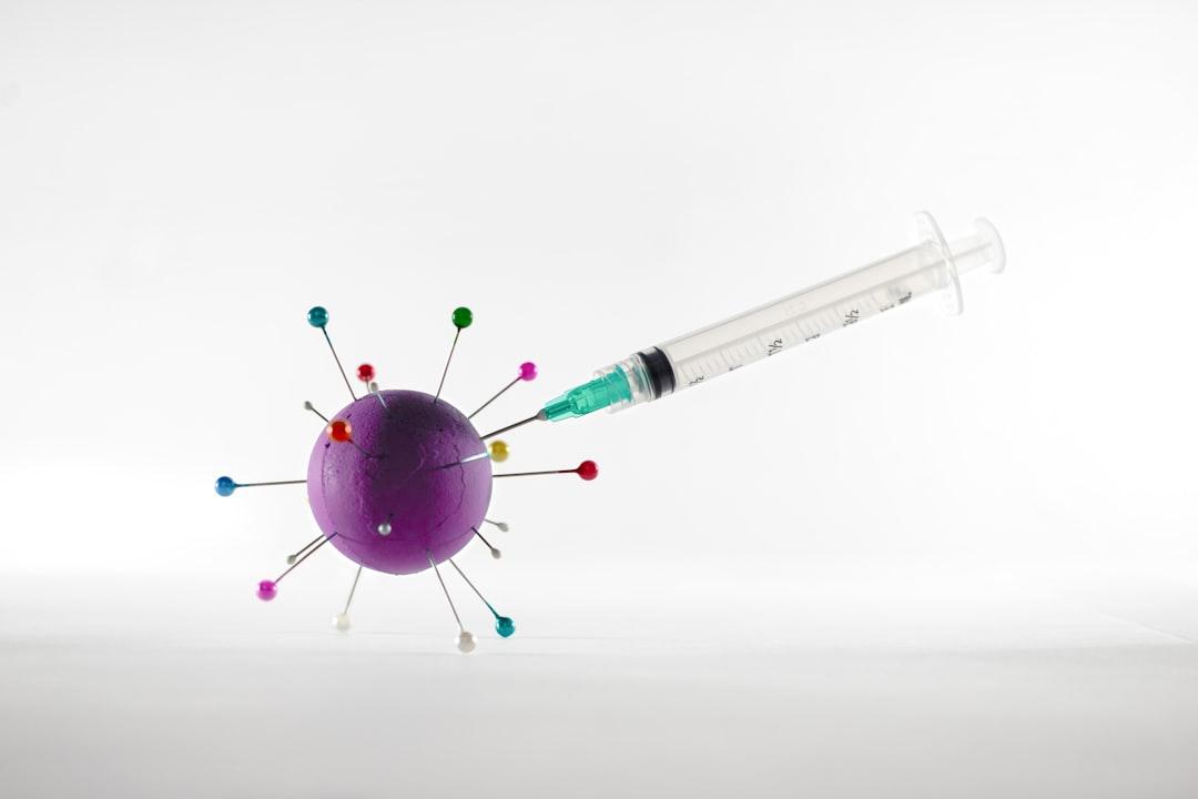 White and green syringe on white surface from Iván Díaz on Unsplash