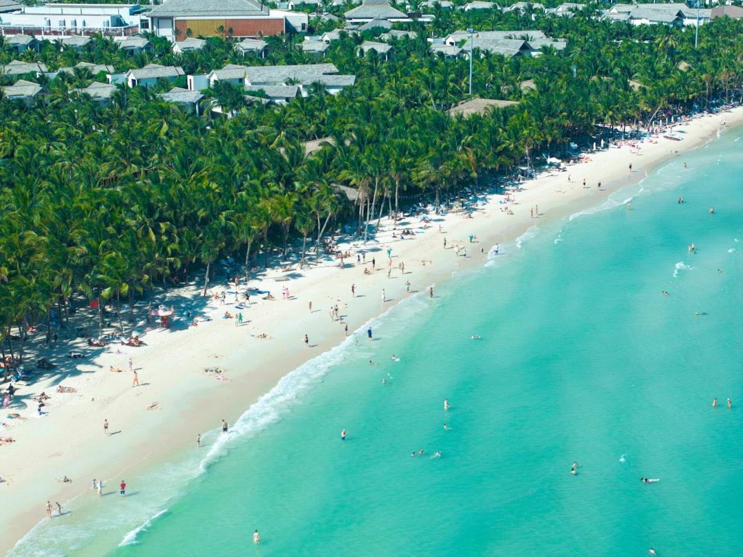 An aerial view of a beach with a lot of people from Vivu Vietnam on Unsplash