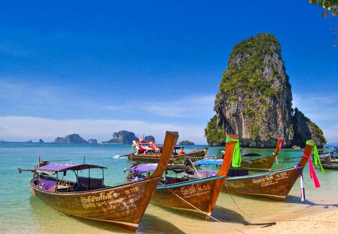 Five brown wooden boats from Sumit Chinchane on Unsplash