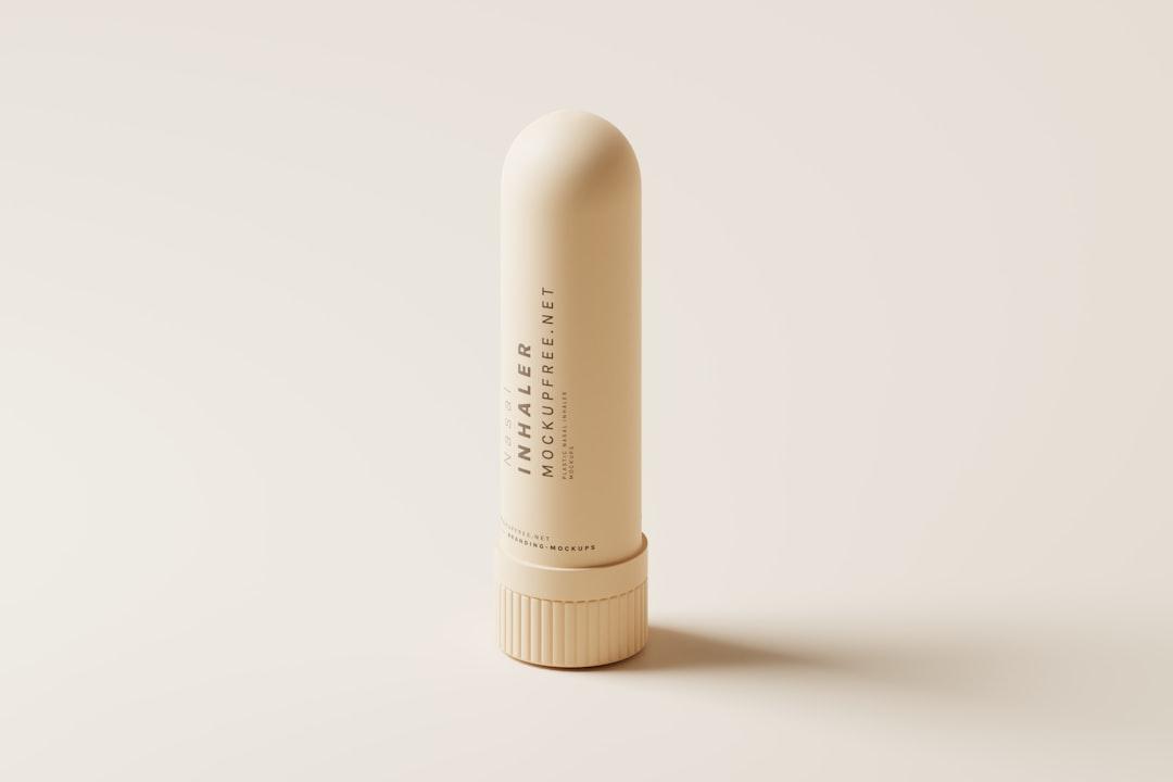 A tube of lip bale on a white background from Mockup Free on Unsplash