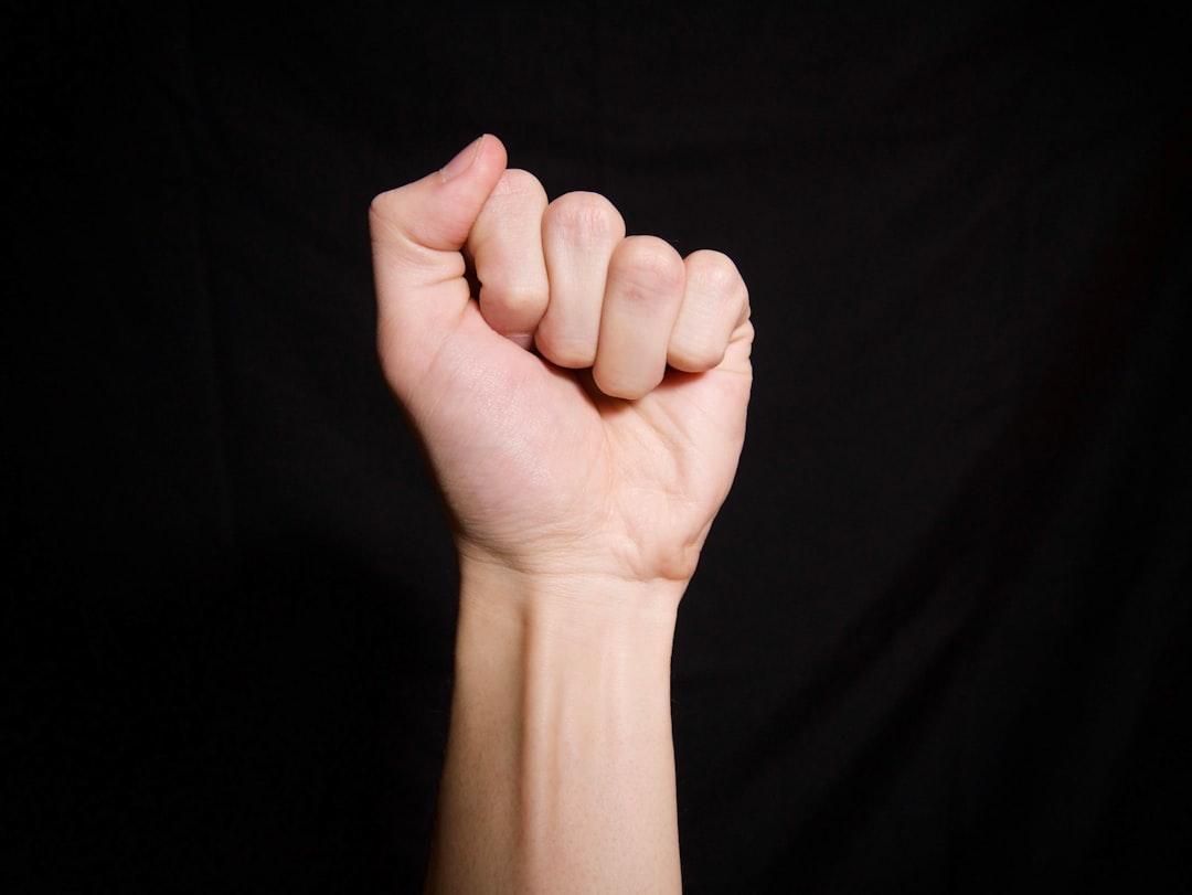 Persons left hand on black textile from Zacke Feller on Unsplash