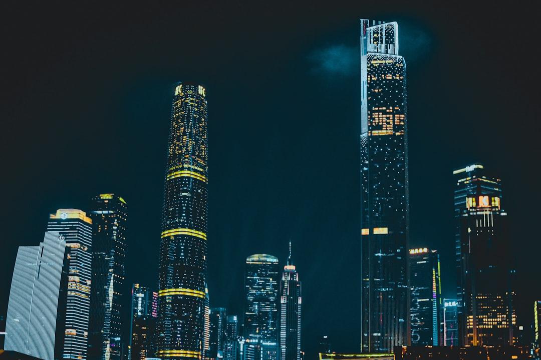 City skyline during night time from 早秋 王 on Unsplash Tiên phong điều trị xâm nhập tối thiểu trong ung thư