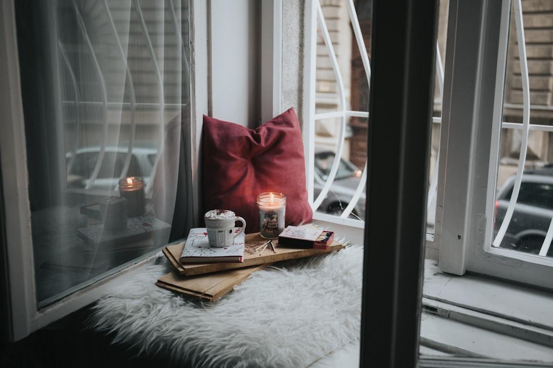 Photo of gel candle on board beside pillow from Alisa Anton on Unsplash Chứng căng thẳng trước kỳ kinh nguyệt có biểu hiện gì?