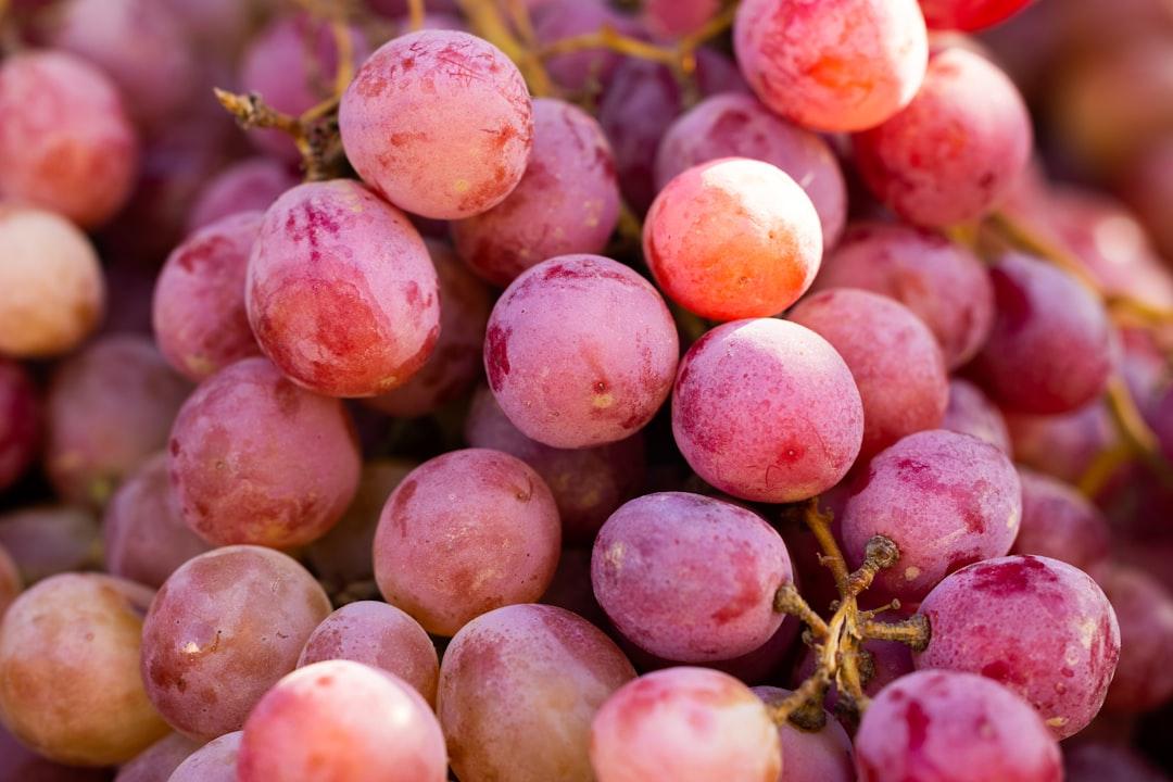 A bunch of grapes that are sitting on a table from engin akyurt on Unsplash