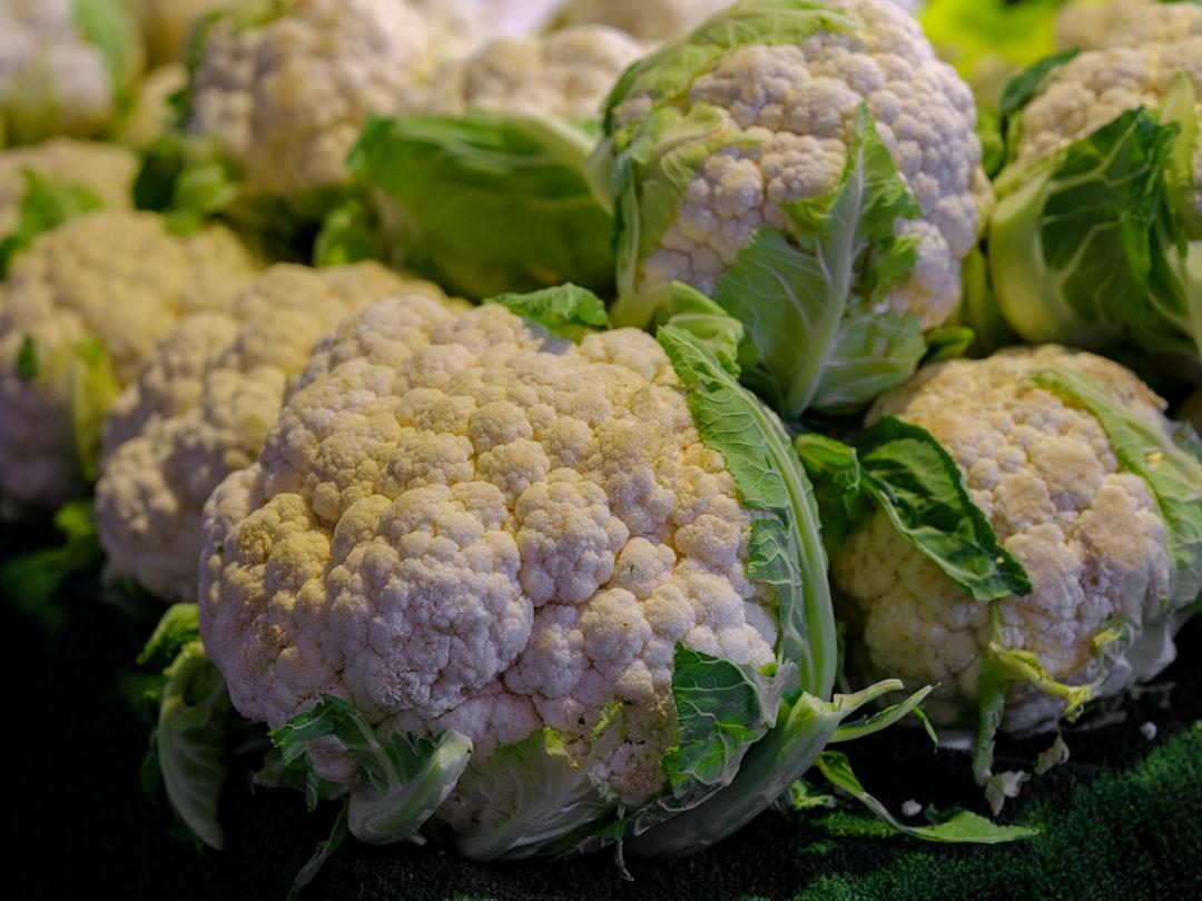 A pile of cauliflower sitting on top of a table from engin akyurt on Unsplash