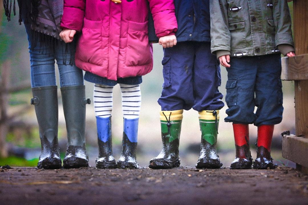 Four children standing on dirt during daytime from Ben Wicks on Unsplash Chương VIII. Tã lót